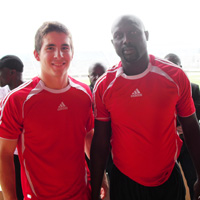 Smith with soccer great George Weah